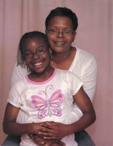 Chinique with her daughter Chakezra as a young girl, an early family portrait